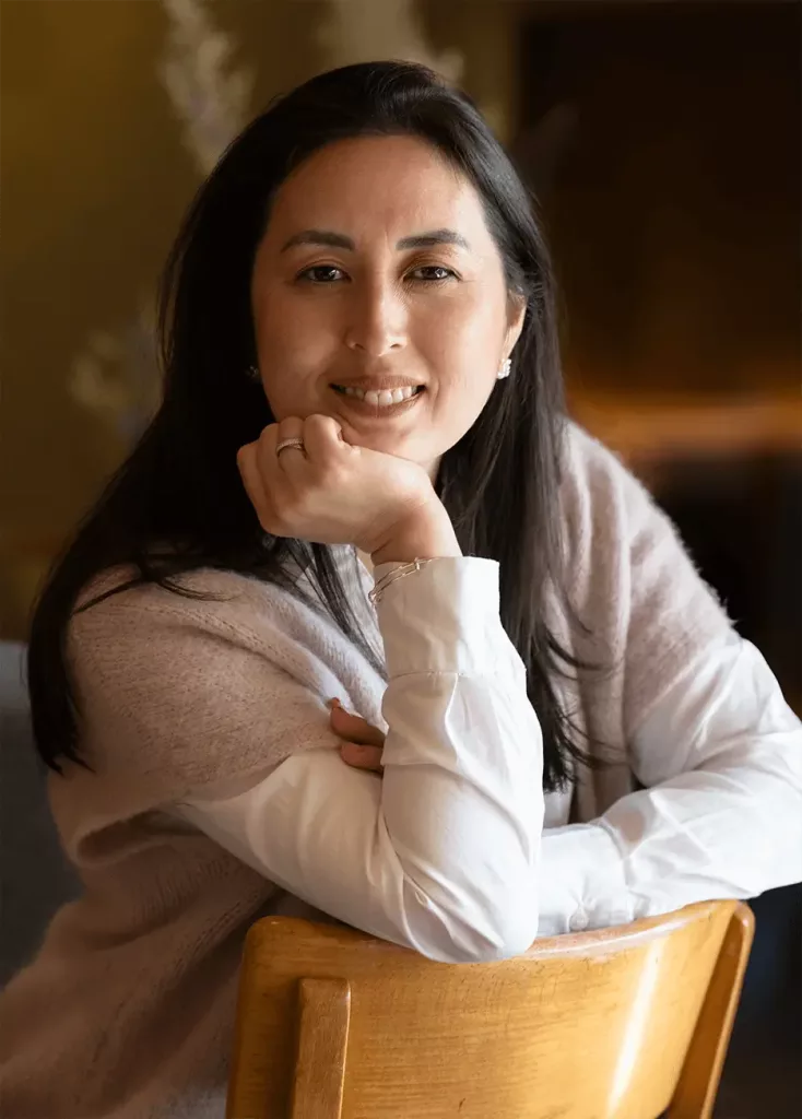 Professional headshot of Bruna Mathys, a certified career coach based in Switzerland, with a warm and welcoming smile.